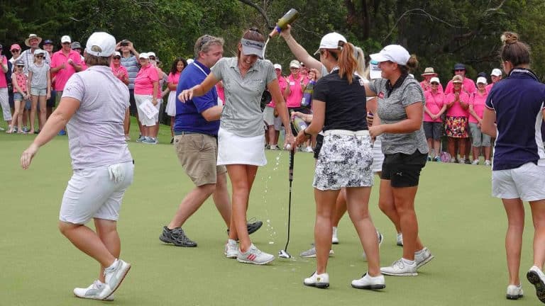 Meghan MacLaren is drowned in Champagne after her NSW Open win