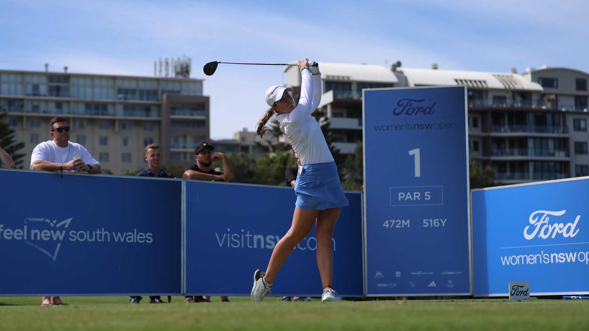 golfer hits. atee shot from the first tee at the womens nsw open
