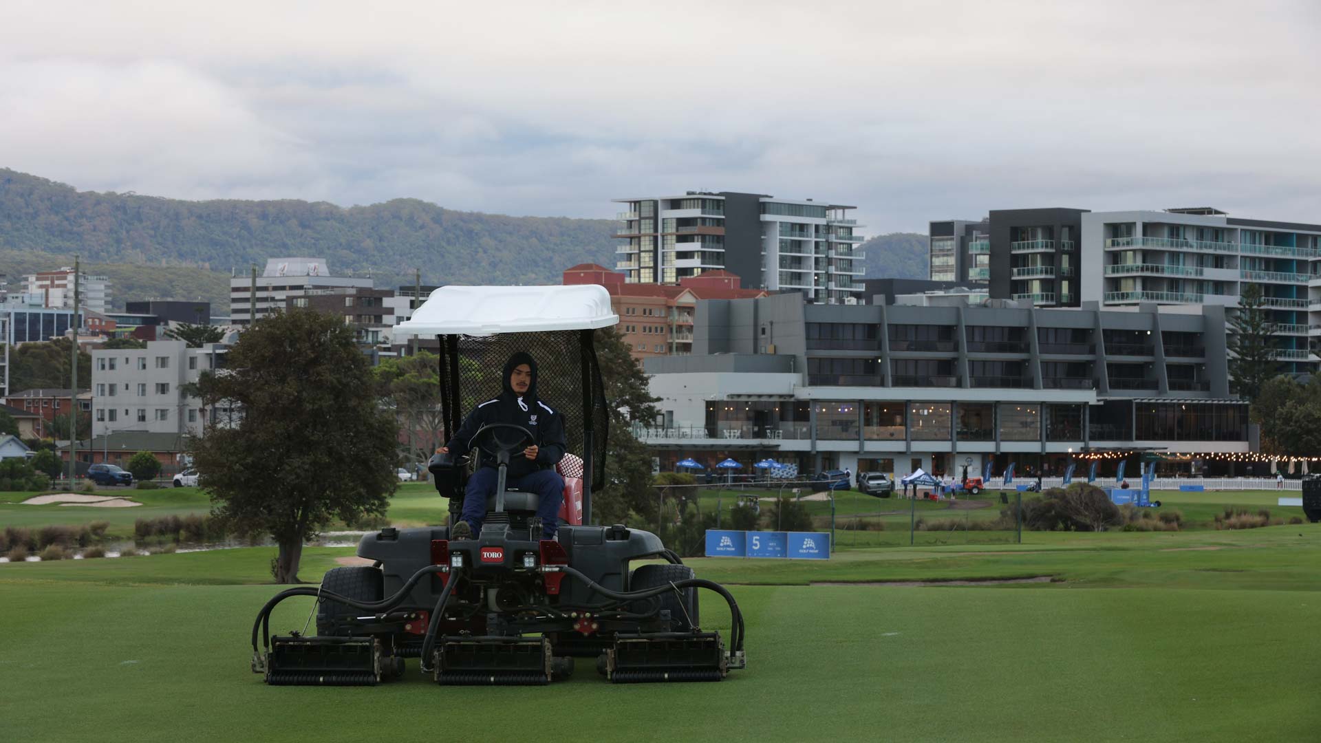 Greenkeeper hard at work preparing the course for third round play at Wollongong Golf Club