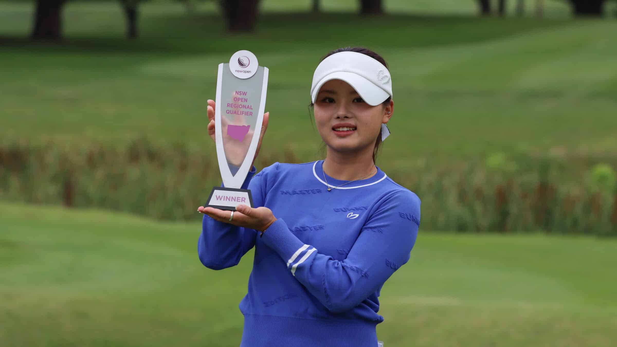Jessica Bang holding her trophy