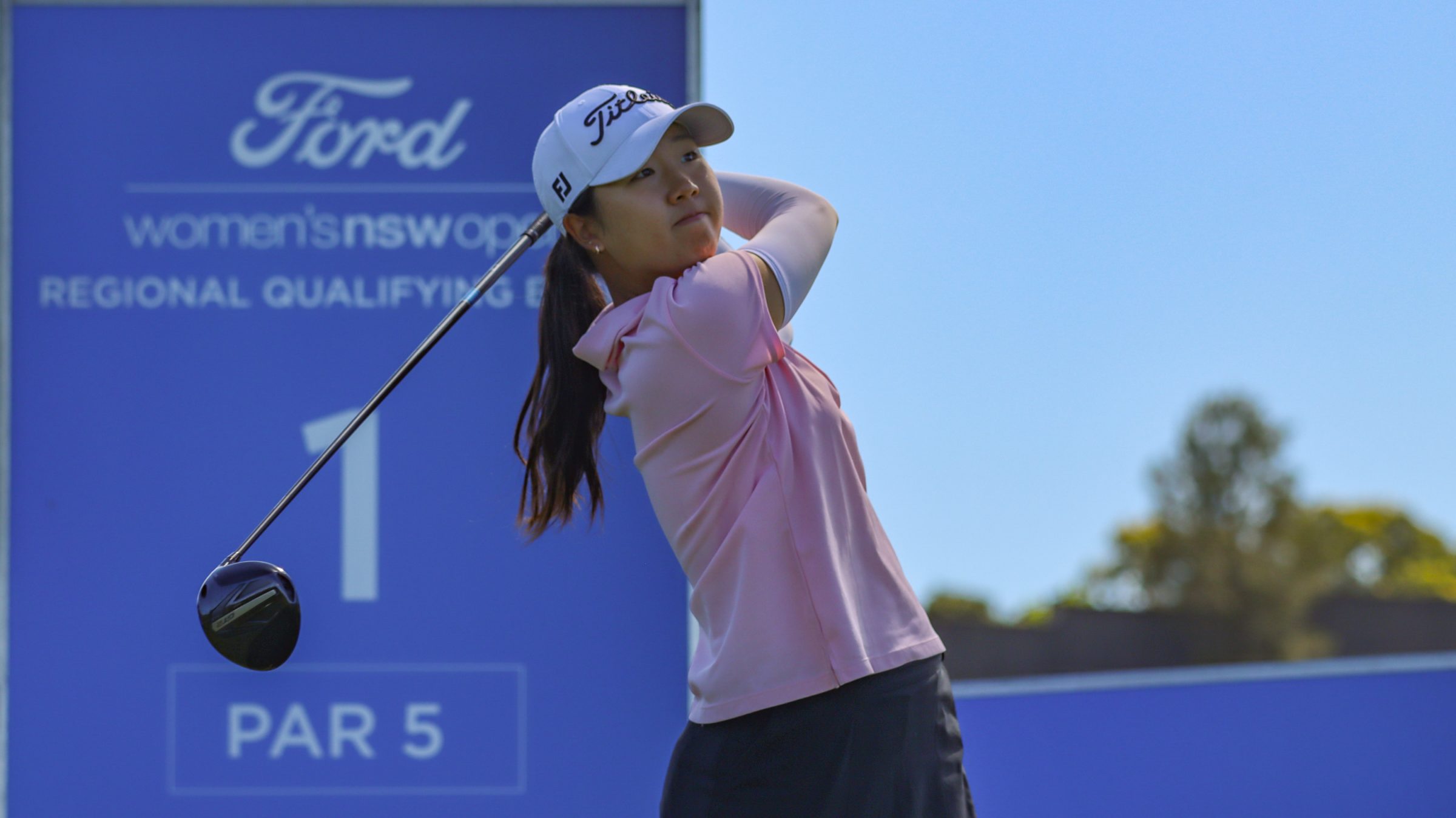 Michelle bang hitting a tee shot