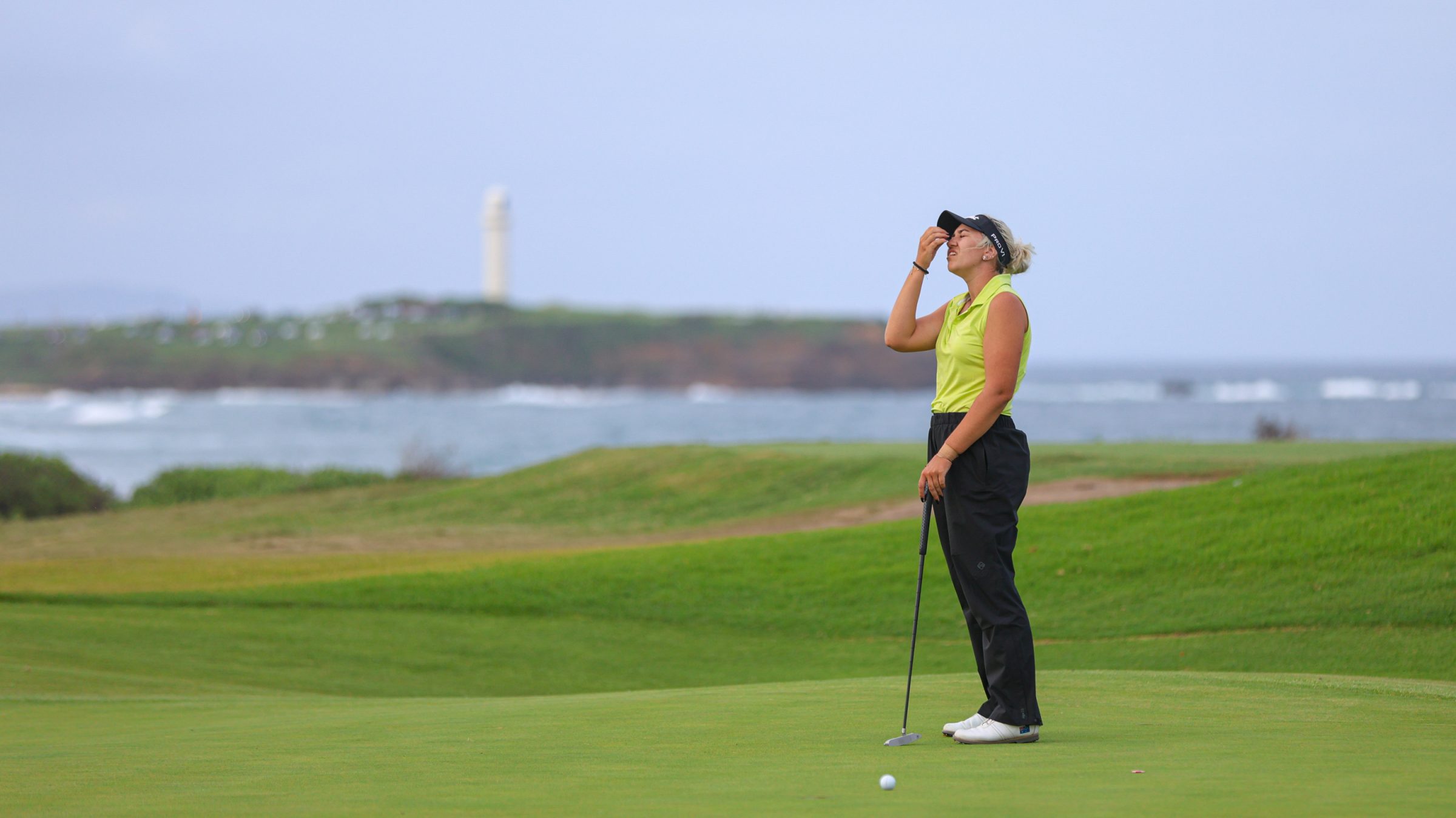 A golfer looking unhappy with a shot