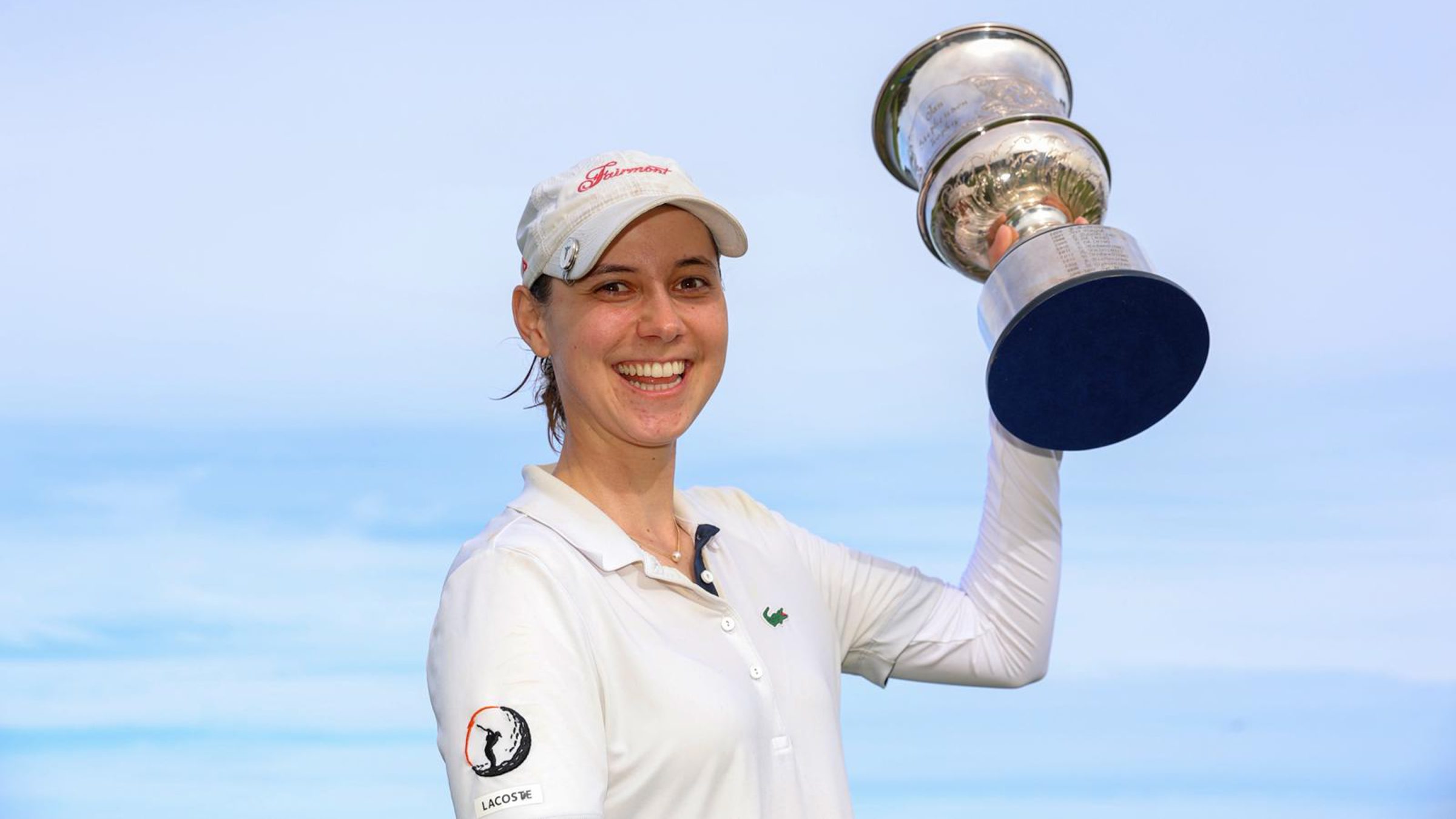 Agathe Laisne with her trophy in the air